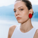 woman-wearing-small-red-como-leather-earrings-weightless-jewelry